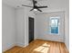 Bedroom features hardwood floors, black ceiling fan, and window at 1517 Cleveland Ave # D, Charlotte, NC 28203