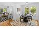 Charming dining room with hardwood floors, a decorative rug, and backyard views at 1517 Cleveland Ave # D, Charlotte, NC 28203