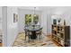 Traditional dining room featuring hardwood floors, neutral walls, and modern light fixture at 1517 Cleveland Ave # D, Charlotte, NC 28203
