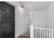 Close up entryway displaying classic black door, white trim, and stylish wall fixture at 1517 Cleveland Ave # D, Charlotte, NC 28203