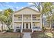 Charming two-story home with a yellow exterior, inviting porches, and well-maintained landscaping at 1517 Cleveland Ave # D, Charlotte, NC 28203