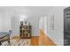 Hallway with hardwood floors and access to other rooms at 1517 Cleveland Ave # D, Charlotte, NC 28203