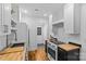 Modern kitchen features white cabinets, butcher block countertops, and stainless steel appliances at 1517 Cleveland Ave # D, Charlotte, NC 28203