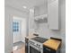 Bright kitchen featuring white cabinets, butcher block countertops, and stainless steel oven at 1517 Cleveland Ave # D, Charlotte, NC 28203