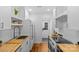 Stylish kitchen features white cabinets, butcher block countertops, and stainless steel appliances at 1517 Cleveland Ave # D, Charlotte, NC 28203