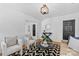 Cozy living room offers hardwood floors, a painted fireplace, and bright white walls at 1517 Cleveland Ave # D, Charlotte, NC 28203