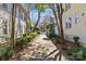 Charming brick walkway lined with greenery and trees leading to the street at 1517 Cleveland Ave # D, Charlotte, NC 28203