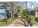A brick walkway lined with lush greenery provides access to the homes at 1517 Cleveland Ave # D, Charlotte, NC 28203