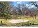 Outdoor volleyball court with trees, path, and lush greenery in the background at 1517 Cleveland Ave # D, Charlotte, NC 28203