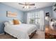 Light-filled bedroom with neutral walls, a queen-sized bed, and a window with views of the outside at 1526 Kilburn Ln, Fort Mill, SC 29715