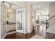 Foyer view showcasing hardwood floors, a chandelier, and an open view into the living room at 1526 Kilburn Ln, Fort Mill, SC 29715