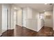 Upstairs hallway with hardwood floors, white trim, and natural light, creating a bright and inviting space at 1526 Kilburn Ln, Fort Mill, SC 29715