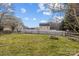 Expansive, fenced backyard featuring a charming fire pit, perfect for outdoor gatherings at 166 Chere Helen Dr, Mooresville, NC 28115