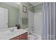 Bathroom featuring a shower and tub combination and a modern sink with wood colored cabinets at 166 Chere Helen Dr, Mooresville, NC 28115