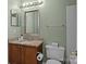 Bathroom featuring granite countertop vanity, framed mirror, and modern fixtures at 166 Chere Helen Dr, Mooresville, NC 28115