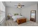 Bright bedroom with natural light, neutral tones, ceiling fan, and comfortable furnishings at 166 Chere Helen Dr, Mooresville, NC 28115