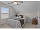 Cozy bedroom featuring neutral colors, ceiling fan, and natural light from the window at 166 Chere Helen Dr, Mooresville, NC 28115