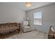 Bedroom room with crib, rocking chair, neutral colors, and a comforting atmosphere at 166 Chere Helen Dr, Mooresville, NC 28115