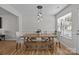 Inviting dining room showcasing a wooden table, bench, and stylish pendant lighting at 166 Chere Helen Dr, Mooresville, NC 28115