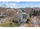 Two-story home with neutral siding, dark roof, attached garage and mature trees at 166 Chere Helen Dr, Mooresville, NC 28115
