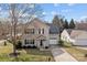 Traditional two-story home with manicured lawn and attached garage on a sunny day at 166 Chere Helen Dr, Mooresville, NC 28115