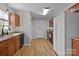 Practical kitchen with wooden cabinets, durable countertops, and convenient access to the backyard at 166 Chere Helen Dr, Mooresville, NC 28115