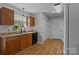 Well-lit kitchen with wood cabinets, granite countertops, and modern appliances for easy cooking at 166 Chere Helen Dr, Mooresville, NC 28115