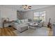 Bright living room with comfortable seating, a large sectional sofa, and stylish decor at 166 Chere Helen Dr, Mooresville, NC 28115