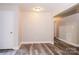 Hallway with gray wood-look floors and neutral paint at 19 Church St, York, SC 29745