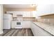 Updated kitchen featuring white cabinets, stainless steel appliances, and granite countertops at 19 Church St, York, SC 29745