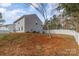 Expansive fenced backyard with lush trees, offering a private outdoor space at 205 Athens Dr # 31, Salisbury, NC 28147