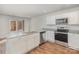 Modern kitchen featuring stainless steel appliances, white cabinets, and a gray countertop at 205 Athens Dr # 31, Salisbury, NC 28147