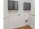 Practical laundry room with dark cabinets and wood-look flooring at 205 Athens Dr # 31, Salisbury, NC 28147