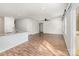 Bright, open-concept space with hardwood floors, white walls, and a partial view of the kitchen at 205 Athens Dr # 31, Salisbury, NC 28147