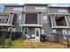 Townhome featuring outdoor patio with a cozy seating area and screened in back porch at 2061 Dornoch Rd, Fort Mill, SC 29708