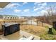 A private backyard in this listing offers a tranquil view of neighboring houses and walking path at 2061 Dornoch Rd, Fort Mill, SC 29708