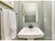 Charming powder room features a pedestal sink, a modern faucet and neutral decor at 2061 Dornoch Rd, Fort Mill, SC 29708