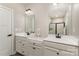 Bathroom featuring double vanity, white countertops, and tile shower with stylish fixtures at 2061 Dornoch Rd, Fort Mill, SC 29708