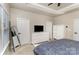 Neutral bedroom with white dresser, TV, and ample storage space provides a relaxing retreat at 2061 Dornoch Rd, Fort Mill, SC 29708