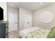 Bright bedroom with white trim, two closets, and a decorative white circular design at 2061 Dornoch Rd, Fort Mill, SC 29708