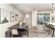 Dining area boasts a modern table setting and flows seamlessly into other living spaces at 2061 Dornoch Rd, Fort Mill, SC 29708