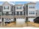 Beautiful townhome exterior boasts stone accents, gray siding and a two-car garage at 2061 Dornoch Rd, Fort Mill, SC 29708