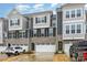 Stylish townhome features gray siding, stone accents, and a two-car garage at 2061 Dornoch Rd, Fort Mill, SC 29708