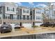 Stylish townhome features gray siding, stone accents, and a two-car garage at 2061 Dornoch Rd, Fort Mill, SC 29708