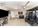 Organized garage space with entertainment options, a foosball table, and a golf cart for recreation at 2061 Dornoch Rd, Fort Mill, SC 29708