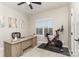 Inviting office space with a modern desk, exercise bike, and natural light from the window at 2061 Dornoch Rd, Fort Mill, SC 29708
