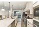 Bright, modern kitchen featuring stainless steel appliances, a large island, and sleek finishes at 2061 Dornoch Rd, Fort Mill, SC 29708