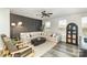 Inviting living room features an accent wall, modern furnishings, and ample natural light at 2061 Dornoch Rd, Fort Mill, SC 29708