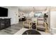 Open-concept living space with stylish seating, modern decor, and light-toned wood flooring at 2061 Dornoch Rd, Fort Mill, SC 29708