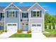 Charming townhome exterior with a one car garage, manicured lawn, and beautiful, contemporary curb appeal at 2061 Stephens Farm Dr, China Grove, NC 28023